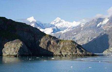 Mountains, glaciers and ice flank Glacier Bay in southeast Alaska. 
